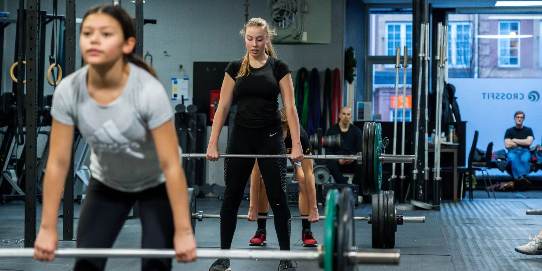 Tidal Fitness women lifting barbells